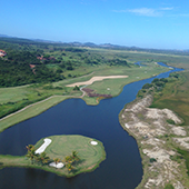 Golf holiday review of Rio de Janeiro, Brazil. Buzios Golf Resort, aerial view of the 17th island green