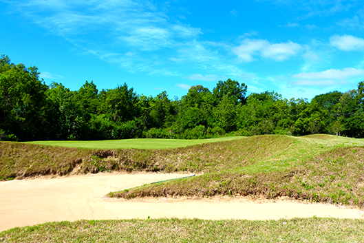 Golf holiday review of Louisiana and the Audubon Golf Trail: Some of the steep bunkering on the 7th hole at Tamahaka Trails Golf Course At Paragon Casino Resort