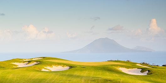 Golf holiday review of St Kitts and Nevis.Irie Fields Golf Course at Kittitian Hill. Looking across to Statia Island
