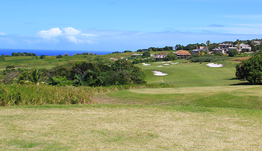 Golf holiday review of St Kitts and Nevis.Irie Fields Golf Course at Kittitian Hill. View from the 18th tee across to the Ocean and Hotel